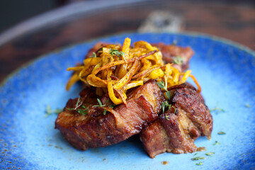 Braised juicy pork ribs with roasted pumpkin fries and fresh thyme.