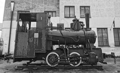 Old steam locomotive. Black and white image of an antique. 