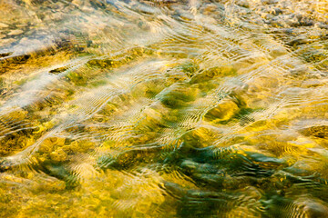 Water wave ripples closeup.