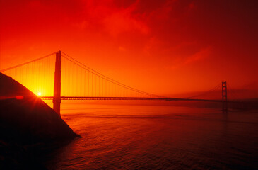 Silhouette of a suspension bridge at dusk, Golden Gate Bridge, San Francisco, California, USA 