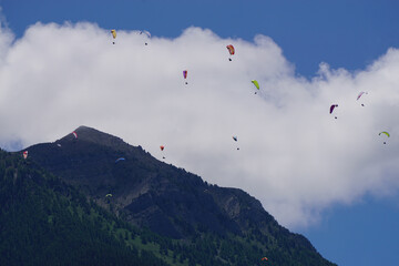 paragliders over the mountains in the French Alps