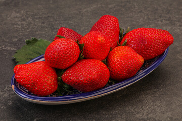 Ripe sweet strawberry with leaf