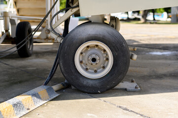 Close up of airplane wheel in an airfield