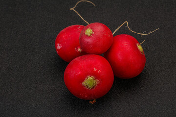 Ripe fresh radish heap over wooden