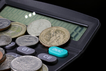 one dollar coin and calculator
