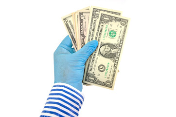 hand in a glove holds dollars / isolated on white / copy space.