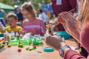 Parents with children do creativity together. Children's creativity center.