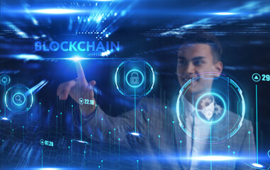 Fototapeta na wymiar Business, Technology, Internet and network concept. Young businessman working on a virtual screen of the future and sees the inscription: Blockchain