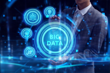 Obraz premium Business, Technology, Internet and network concept. Young businessman working on a virtual screen of the future and sees the inscription: Big data