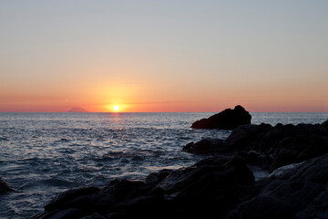 Sunset on the rocky shore. Tyrrhenian Sea.