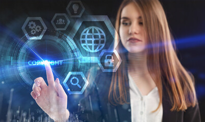 Business, Technology, Internet and network concept. Young businessman working on a virtual screen of the future and sees the inscription: Copyright