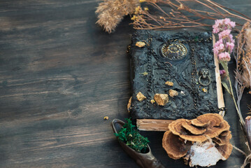 Magic book on the magic table background.