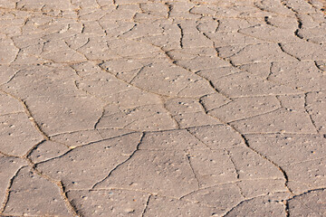 Cracked asphalt surface of the old road.