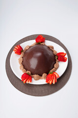 Chocolate dessert served with strawberries