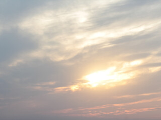 with the sunshine and clouds above the horizon. Divine glow through the clouds of the evening warm sun. Concept of peace and happiness.