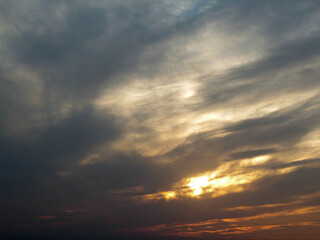 with the sunshine and clouds above the horizon. Divine glow through the clouds of the evening warm sun. Concept of peace and happiness.