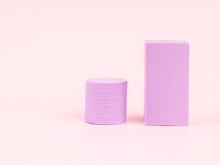Stack of pink blocks. Geometrical figures still life composition. Platonic solids figures, simplicity concept photography. Pink rectangles and cylinders