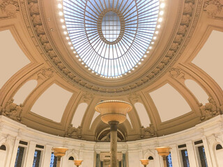 Hall or lobby of historic public building with oval glass dome or rotunda
