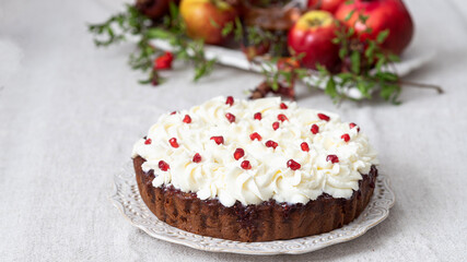 Honey cake with mascarpone cream and pomegranate seeds