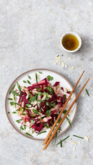Spicy salad Asian-style with beets, apples and almonds