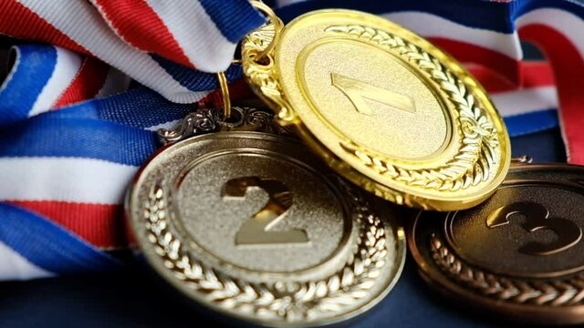 concept for winning or success. Gold medal, silver medal and bronze medal on yellow background. video stock footage
