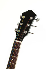 neck of an acoustic guitar on a white background