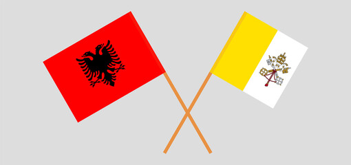 Crossed flags of Vatican and Albania