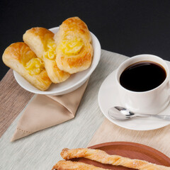 High angle view of danish pastries served with a cup of coffee
