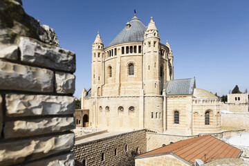 Fototapeta na wymiar (Selective focus) Stunning view of the Abbey of the Dormition during a sunny day. The Abbey of the Dormition is an abbey and the name of a Benedictine community in Jerusalem, Israel.