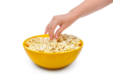 Child hand takes popcorn from bowl. Isolated on white.