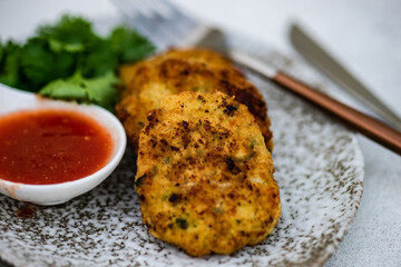 Chicken cutlet served on plate