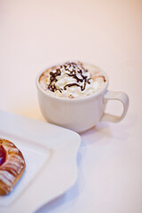 High angle view of a Danish pastry with a cup of coffee