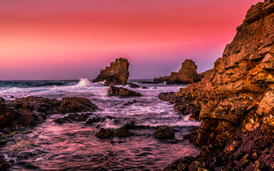 sunset over the sea and the rocks