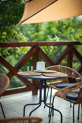 interior of a summer cafe, rattan furniture in a rustic style