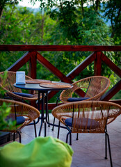 interior of a summer cafe, rattan furniture in a rustic style