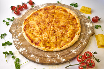 Italian pizza Margarita with mozzarella and tomato sauce on wooden table