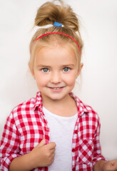 beautiful girl looking at the camera, beautiful smile, blonde hair, white teeth