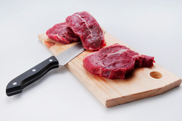 High angle view of steaks on a cutting board