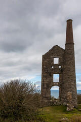 Fototapeta na wymiar Ruins of a Cornish tin mine: Carn Galver Mine and engine house, Penwith Peninsula, Cornwall, England, UK. 