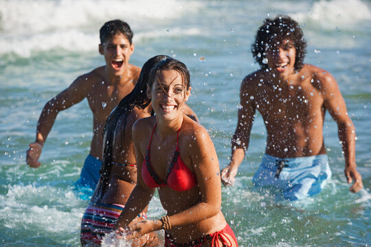 Friends playing in ocean