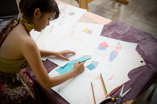 Indian female fashion designer drawing