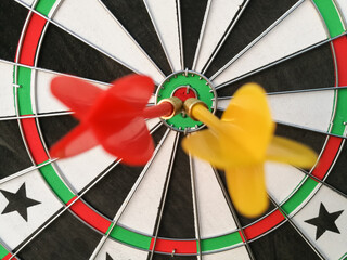 Dart arrow hit target at bullseye