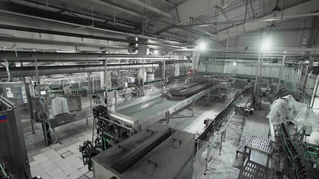Beer factory interior with a lot of machines in work