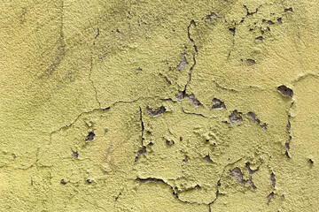 Abstract concrete, weathered with cracks and scratches. Remains of green paint on the concrete wall. Landscape style. Grunge Concrete Surface. Great background or texture.