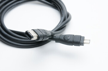 Cable with 1394 and iLink plugs on white background