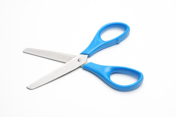 Blue baby scissors on a white background