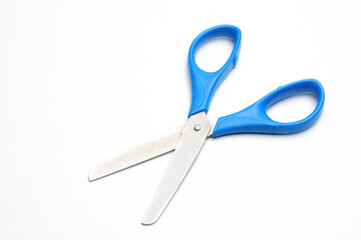 Blue baby scissors on a white background