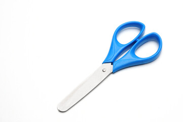 Blue baby scissors on a white background