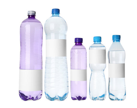 Bottles of pure water with blank labels on white background
