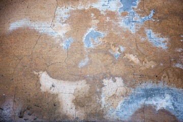 Abstract concrete, weathered with cracks and scratches. Remains of paint different colors on wall. Landscape style. Grunge Concrete Surface. Great background or texture.